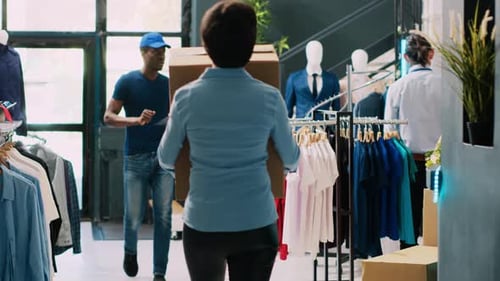 Manager Helping Courier with Packages