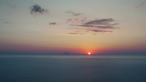 Sunset Sky on the Ocean with Sun and Orange Clouds