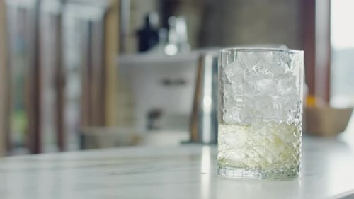 Cold cocktail served in a glass at a bar
