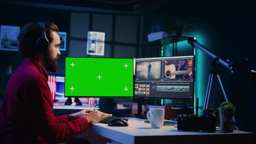 Photo Editor Selecting Best Photographs Using Retouching Application on Chroma Key Display