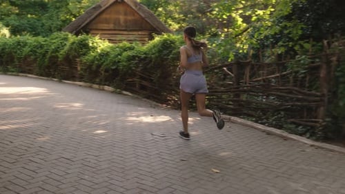 Woman Running Fitness Park
