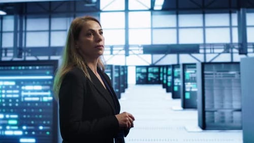 Woman in Server Hub Establishment Doing Diagnosis Looking for Equipment Bugs