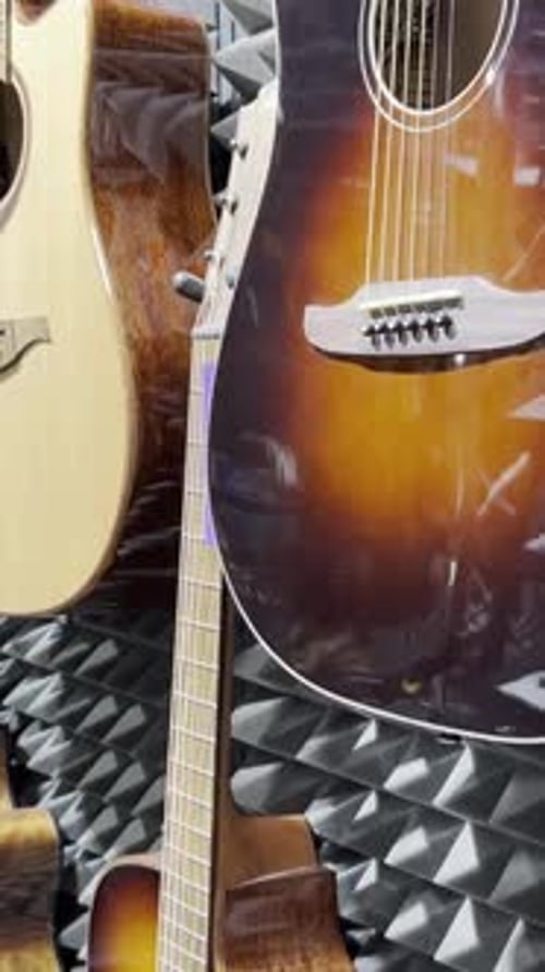 Shop for Acoustic Guitars of Various Sizes and Colors Concept of Musical Instruments