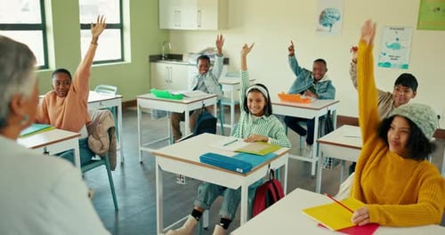 Enthusiastic Students Raising Hands in Classroom