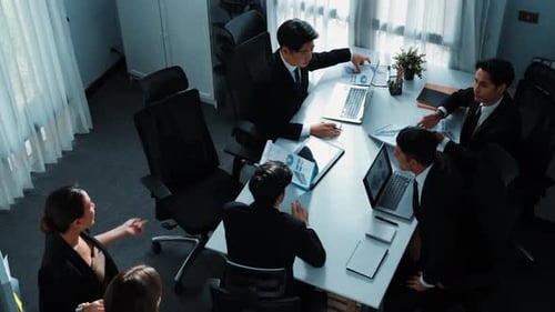 Top view of smart manager present financial graph to diverse team. Directorate.