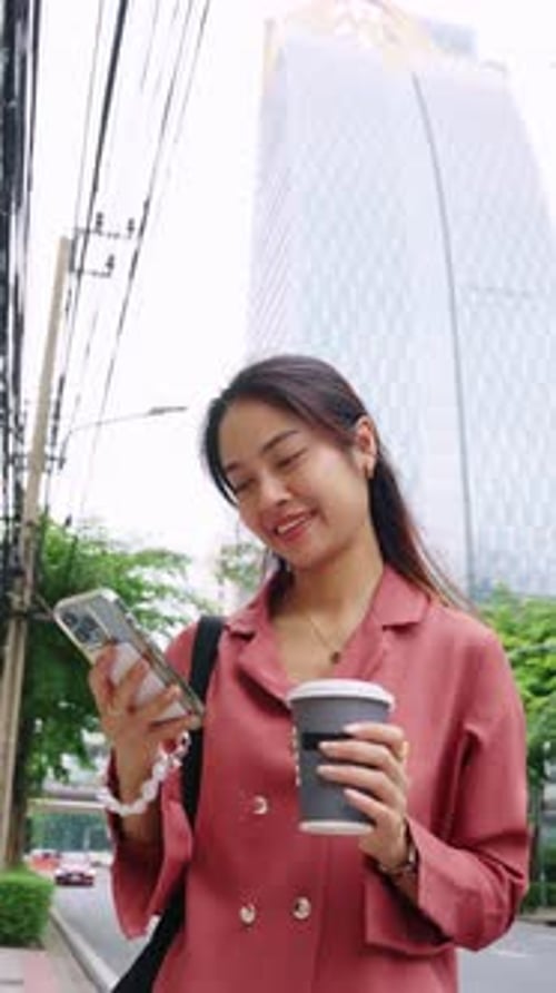 Businesswoman Walking and Texting in Slow Motion Bangkok Thailand