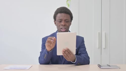 Young Adult Having Difficult Conversation on Tablet