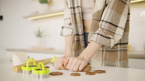 Close Up Shot in a Warm and Inviting Kitchen Environment a Person is Joyfully Preparing Delicious