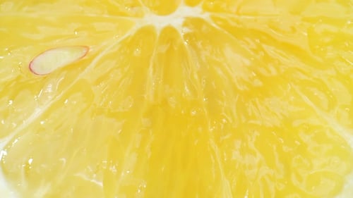 Extreme Close Up of Juicy Yellow Lemon Slice