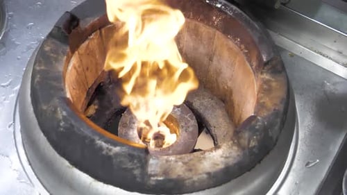 Flames Erupt from Circular Commercial Burner