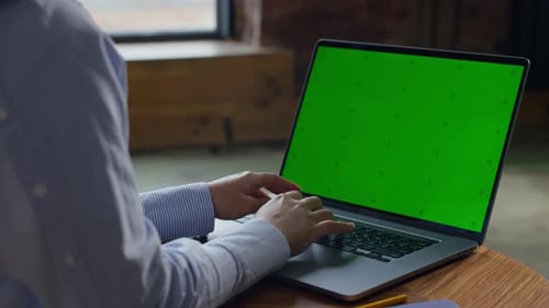 Typing on Laptop with Green Screen Mockup