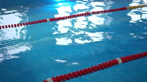 Ein leeres Schwimmbad mit vielen Gassen, das durch rote Poolbrecher getrennt ist Ein leeres Sportbecken