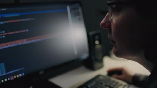 Programmer specialist in programming works remotely at home uses a laptop computer. Computer