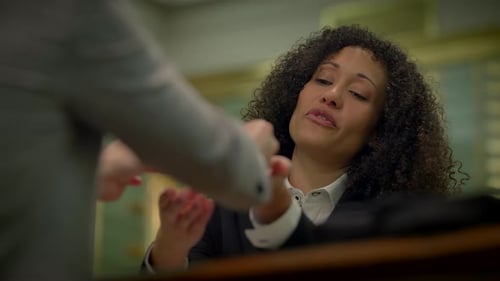 Multi Ethnic Group of Two People Having a Business Sales Meeting Inside Bank