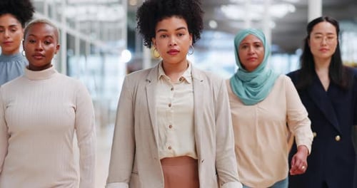 Diverse Women Walking Forward in Modern Office