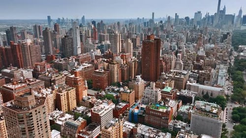 Diversity of New York architecture. Drone footage above the cityscape on bright sunny day.