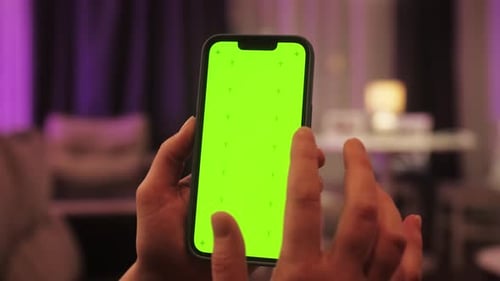 Woman Swiping Gesture on Chroma Key of Modern Smartphone Person Resting at Home and Using Smartphone