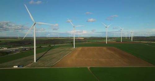 Renewable Energy Source Aerial View of Wind Turbines Standing on the Green Field Aerial View of a