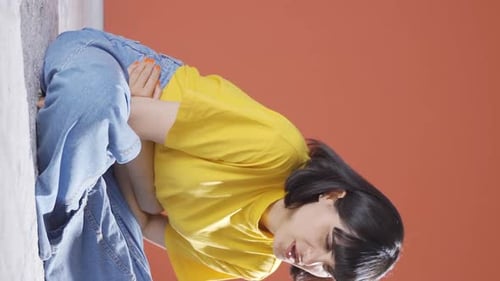 Young Woman Suffering From Stomach Pain