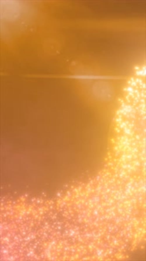 Bright golden lens flare and sunburst effect creating soft glowing orbs on an amber background