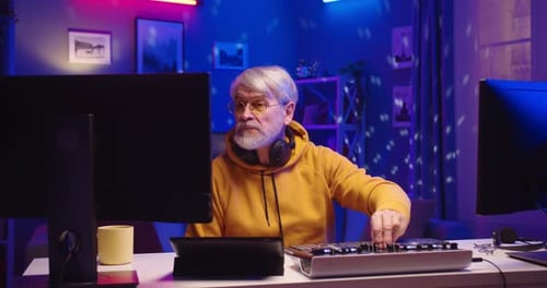Portrait of Caucasian Old Man DJ Playing Music at Home Recording Studio Workshop Senior Male Making