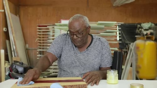 Senior Man Living with HIV Working in His Woodshop 60-65 Years
