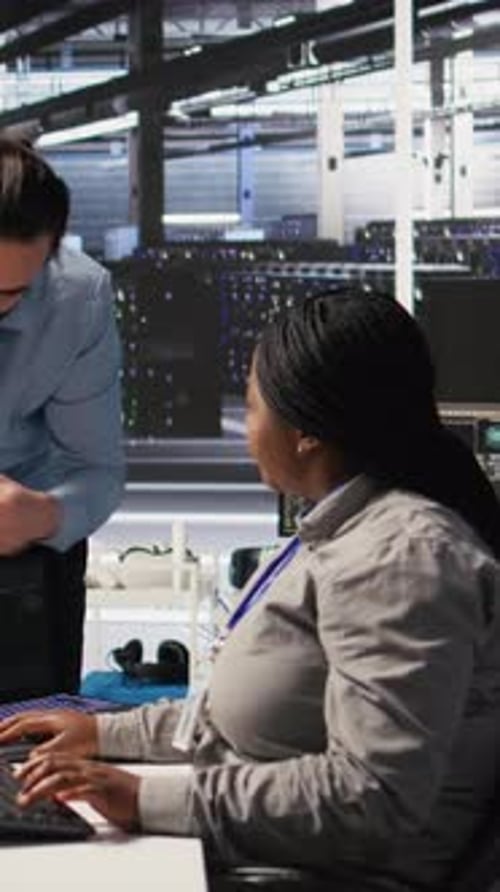 Man and Woman Working in Server Room
