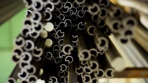 Abstract Video of Metal Pipes Stacked on Top of Each Other During Production