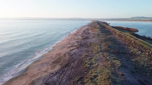 Bird's Eye View of Beach with Sand Grass and Stones Washed By Bay of Black Sea and Lake Under Sky in