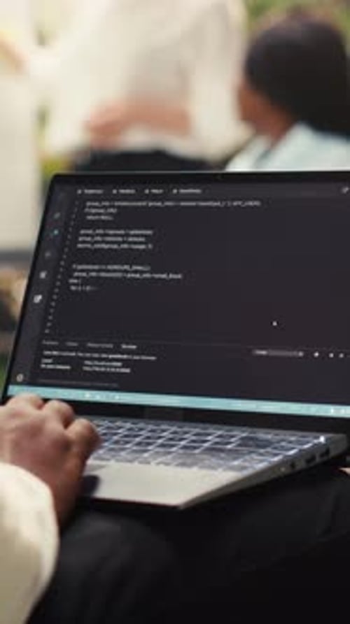 Vertical Video Businessman Programmer Using Binary Code on Laptop During Informal Work