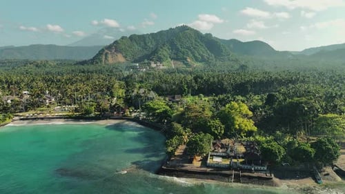 Lush tropical island with turquoise water aerial view