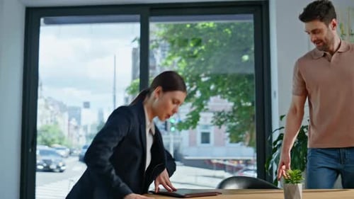 Professional Woman Meeting Man in Office Conference Room Business Partners