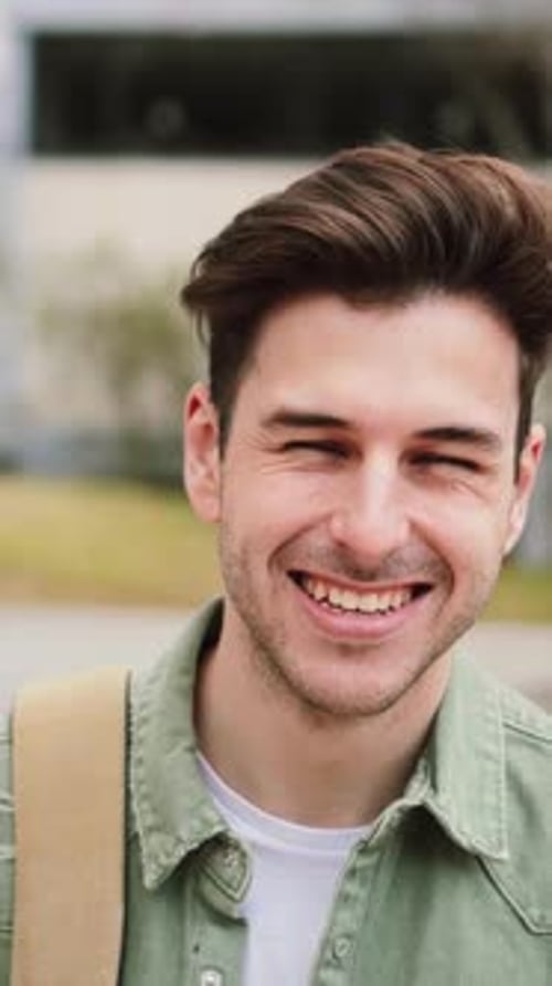Vertical Close Up Individual Portrait of a Caucasian Happy Male in University Campus Portrait of