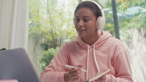 Young Woman Attending Online Meeting