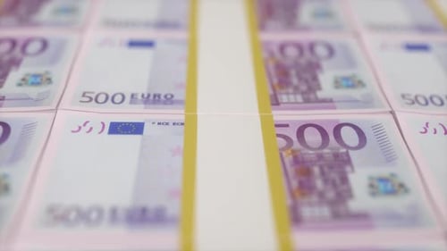 Financial Background With Rows of Uncut Purple Euro Notes in Shallow Focus