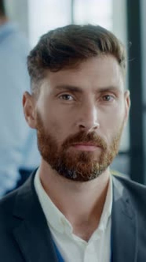 A Thoughtful Professional Posing in a Chic Modern Office Environment Engaged in Work