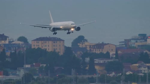 Airplane Flies Over the City