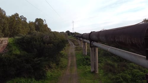 Water distribution pipeline in Sardinia Italy, aerial drone in countryside