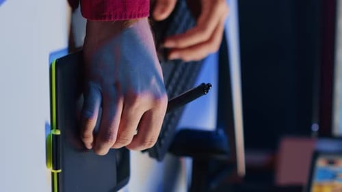 Hands Working on Computer and Graphics Tablet