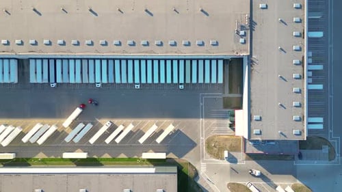 Aerial view of goods warehouse. Logistics center in industrial city zone from above. Aerial view of