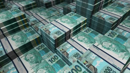 Brazil Real 100 banknote packs - flying over BRL money stack