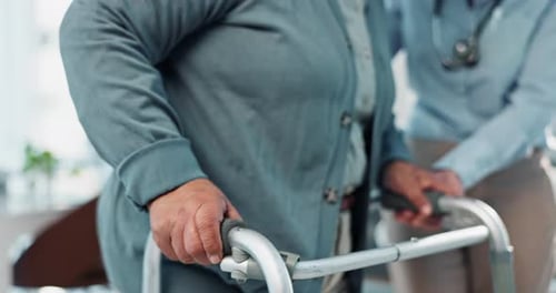 Senior Woman Walking with Walker, Assisted by Doctor