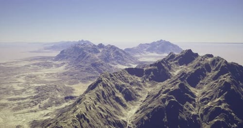 Captivating Mountain Range Under Clear Blue Sky in Remote Landscape