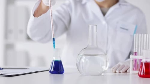 Science, Chemistry, Medicine and People Concept - Close Up of Scientist With