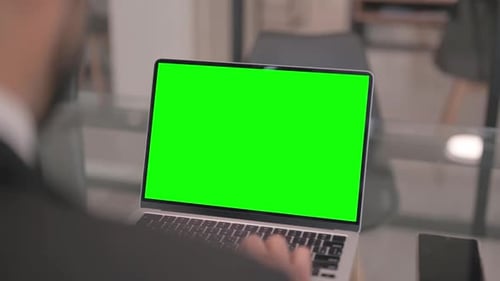 Businessman Working on Laptop with Green Screen Chroma Key