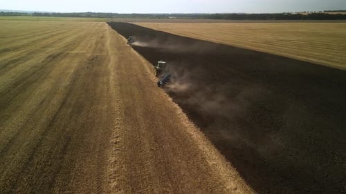Tractors plowing the field in Ukraine