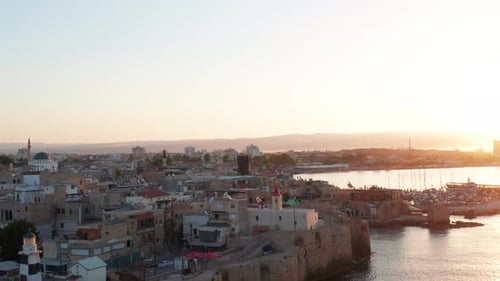 Acre old city port houses and Mosque at sunrise, Aerial view