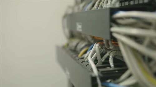 Closeup of Network Hub and Cables Blue Toned