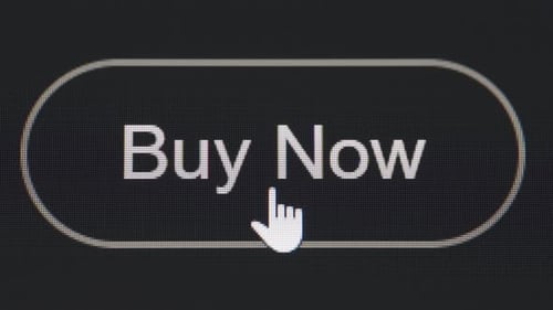 Clicking buy now button on the black computer screen