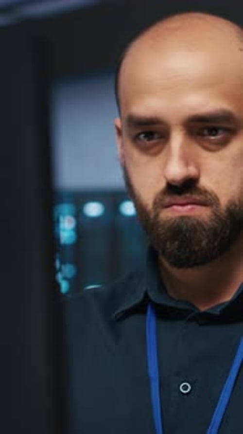 Vertical Video IT Worker Programming in Data Center Writing Code on PC